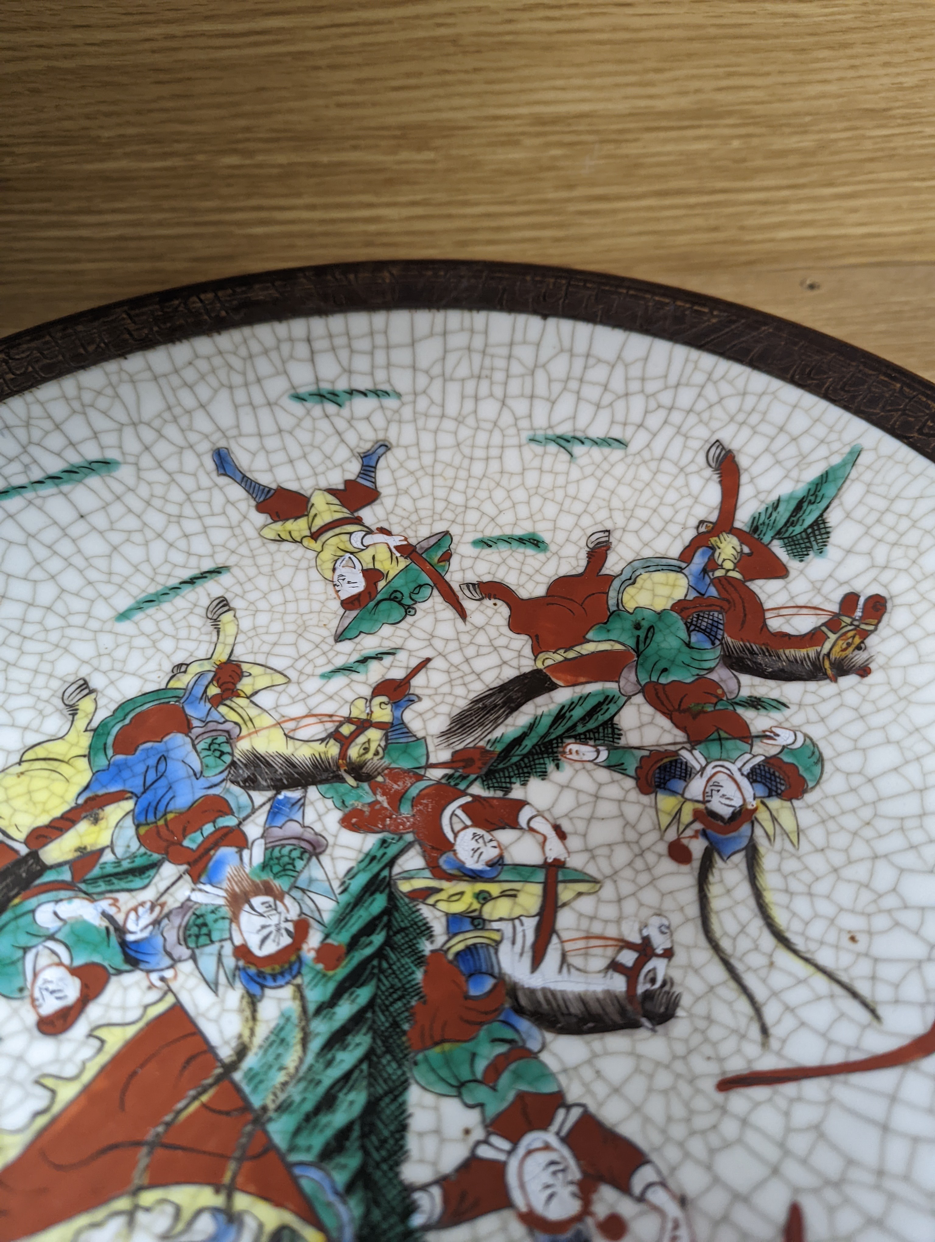 A Chinese famille verte 'warriors' crackle glaze dish 33cm